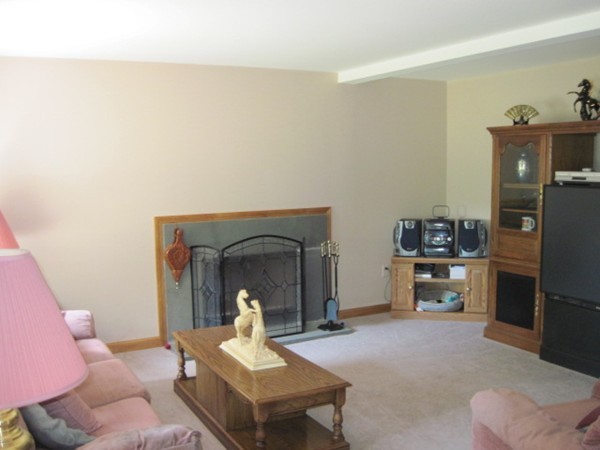 66 Old Poor Farm Road Ware, MA 01082 - Photo 8 of 26 a living room with furniture and a fireplace