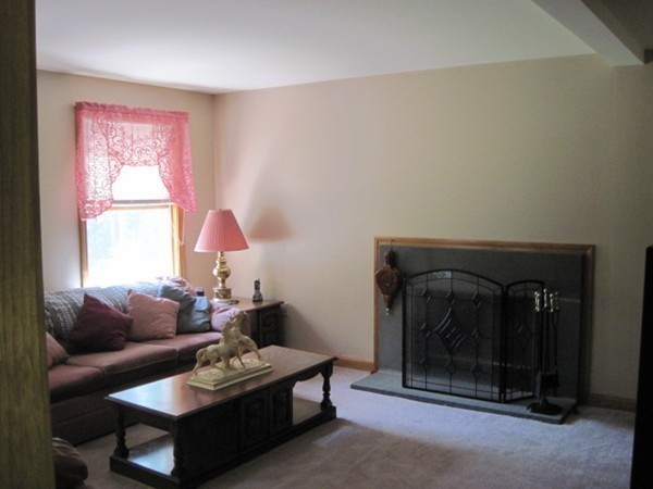 66 Old Poor Farm Road Ware, MA 01082 - Photo 9 of 26 a living room with furniture and a fireplace