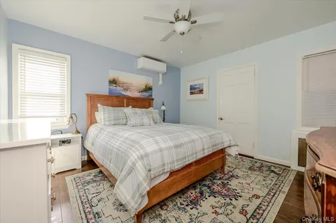 a bedroom with a bed and a window in it