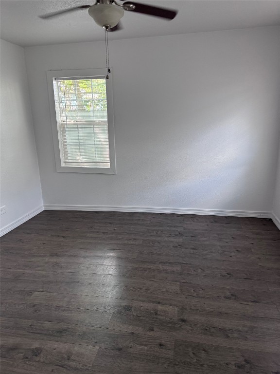 2209 East 5th Street Austin, TX 78702 - Photo 6 of 17 an empty room with wooden floor and windows