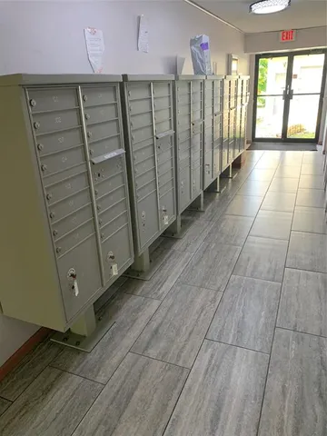 a view of a livingroom with a ceiling fan and window