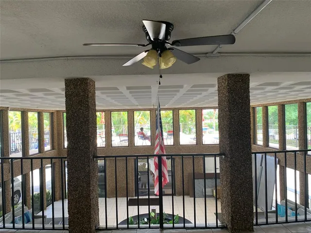 a living room with a large window and a table