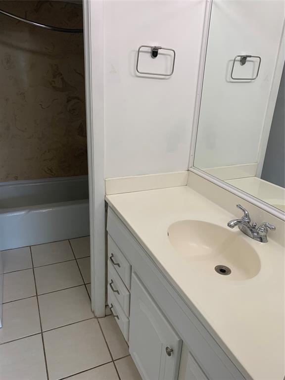 9355 Southwest 8th Street, Unit 321 Boca Raton, FL 33428 - Photo 8 of 15 a bathroom with a sink and a shower