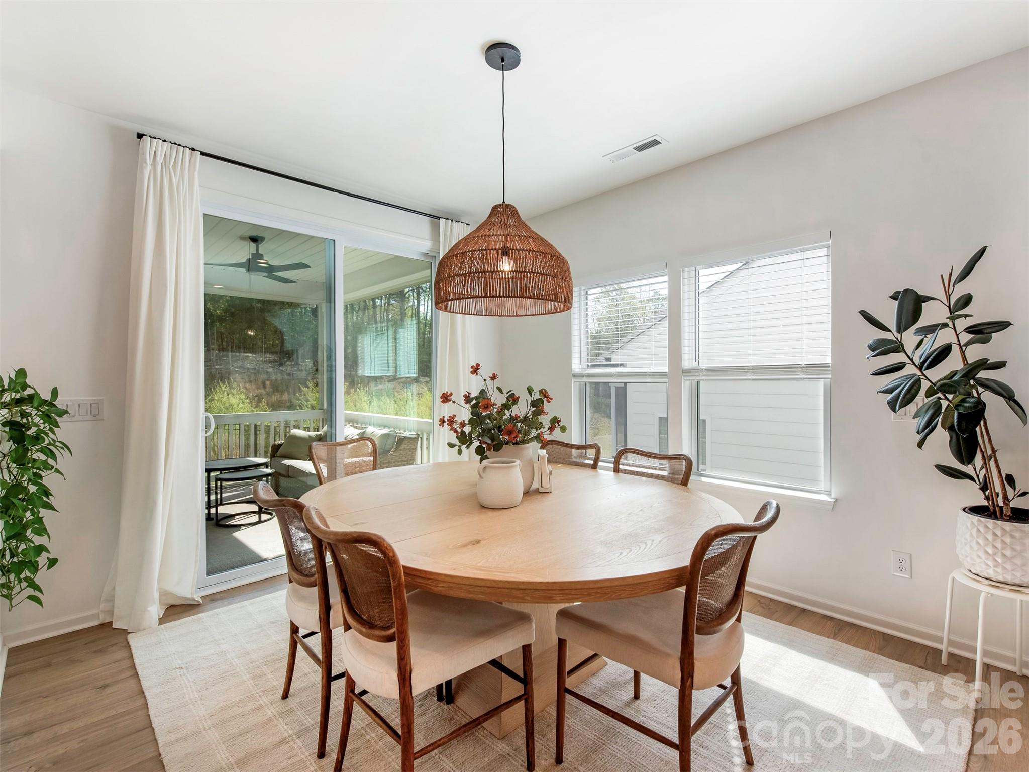 966 Scotch Meadows Loop Monroe, NC 28110 - Photo 15 of 48 a dining room with furniture window and wooden floor