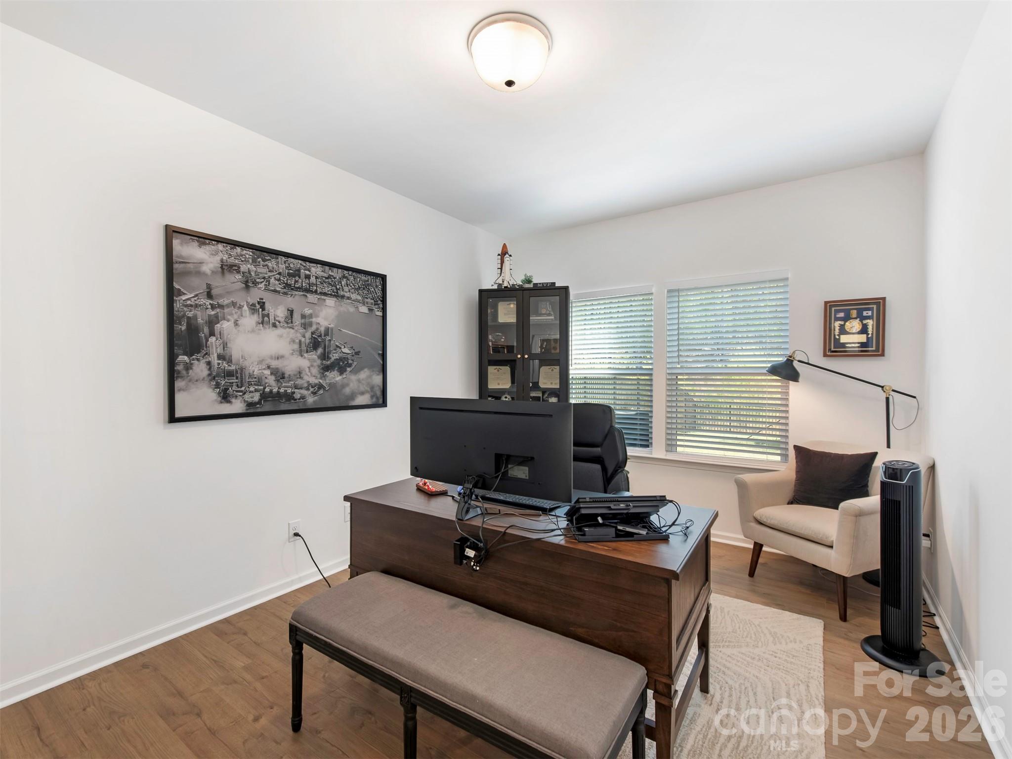 966 Scotch Meadows Loop Monroe, NC 28110 - Photo 16 of 48 a living room with furniture and a flat screen tv
