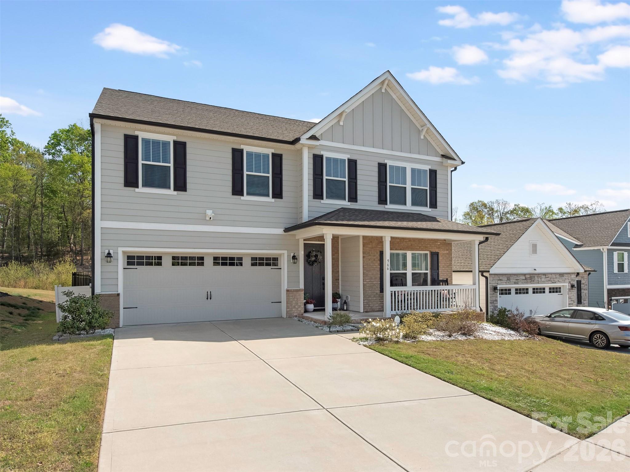 966 Scotch Meadows Loop Monroe, NC 28110 - Photo 2 of 48 a front view of a house with a yard
