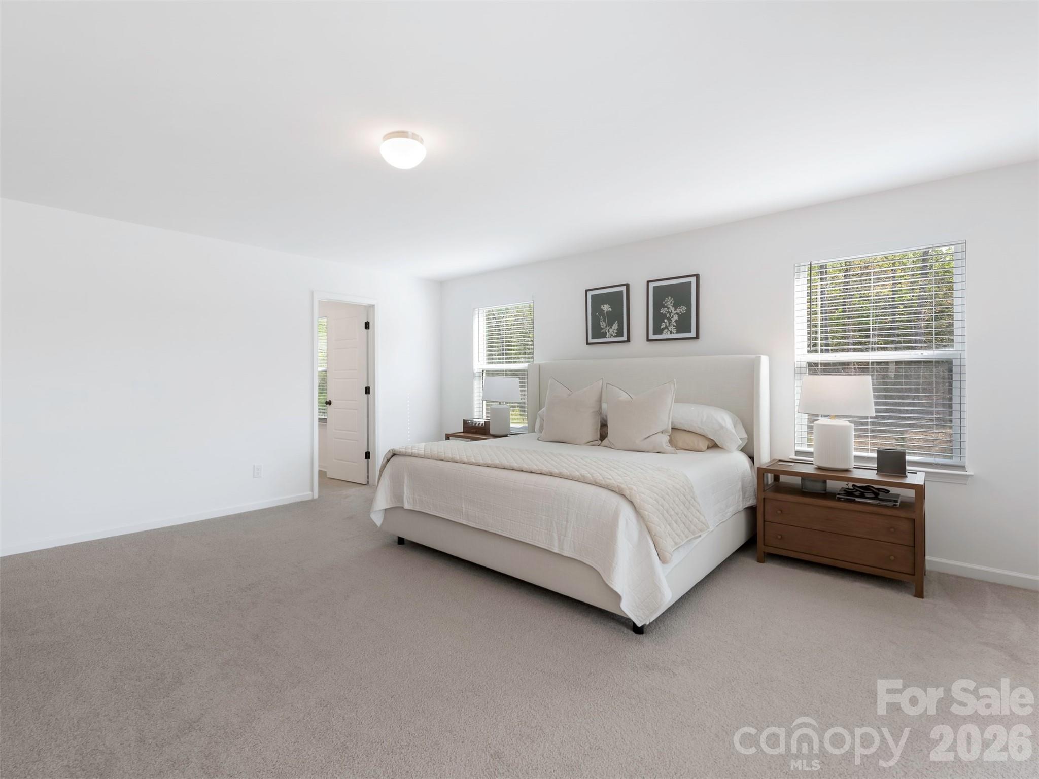 966 Scotch Meadows Loop Monroe, NC 28110 - Photo 23 of 48 a bedroom with a bed and a window