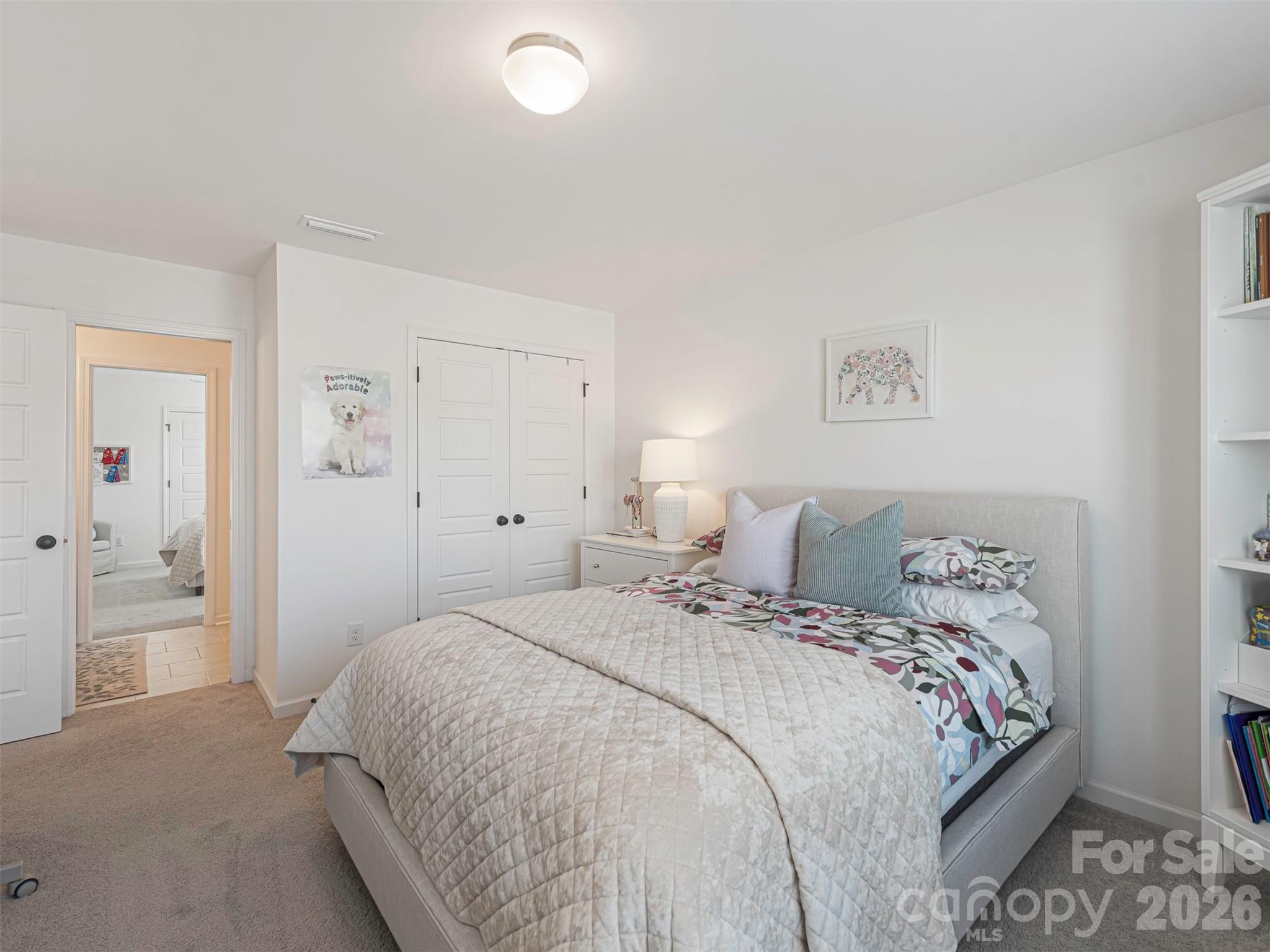 966 Scotch Meadows Loop Monroe, NC 28110 - Photo 32 of 48 a bedroom with a bed and a painting on the wall