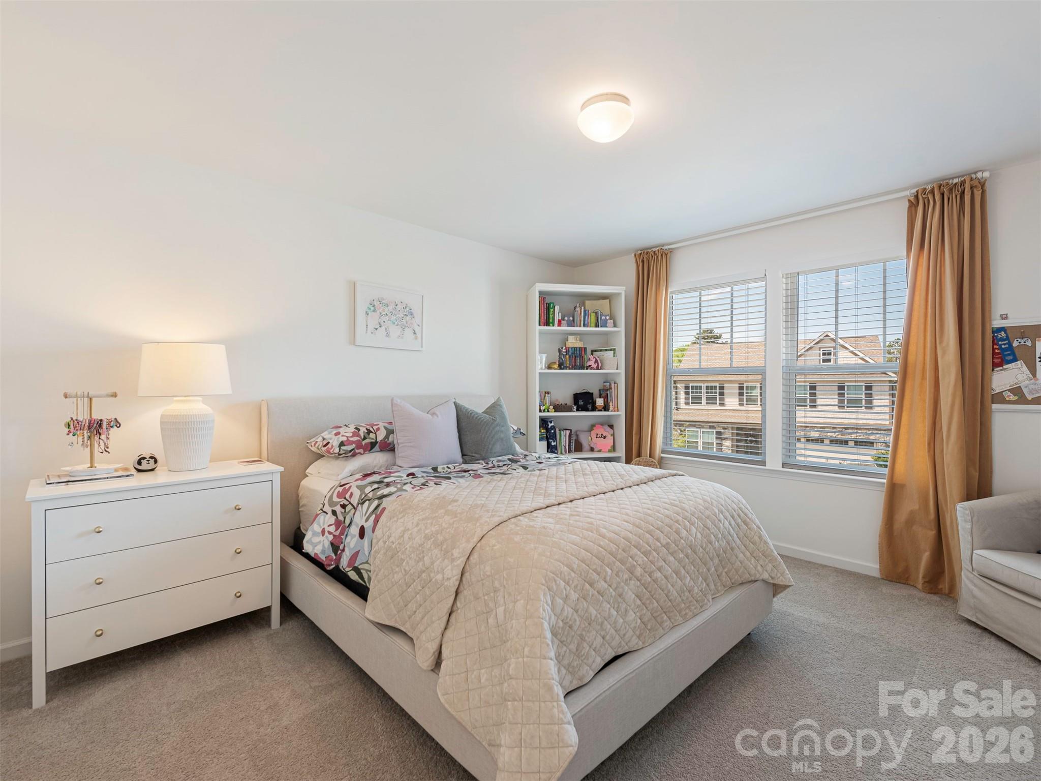 966 Scotch Meadows Loop Monroe, NC 28110 - Photo 33 of 48 a bedroom with a large bed and a window