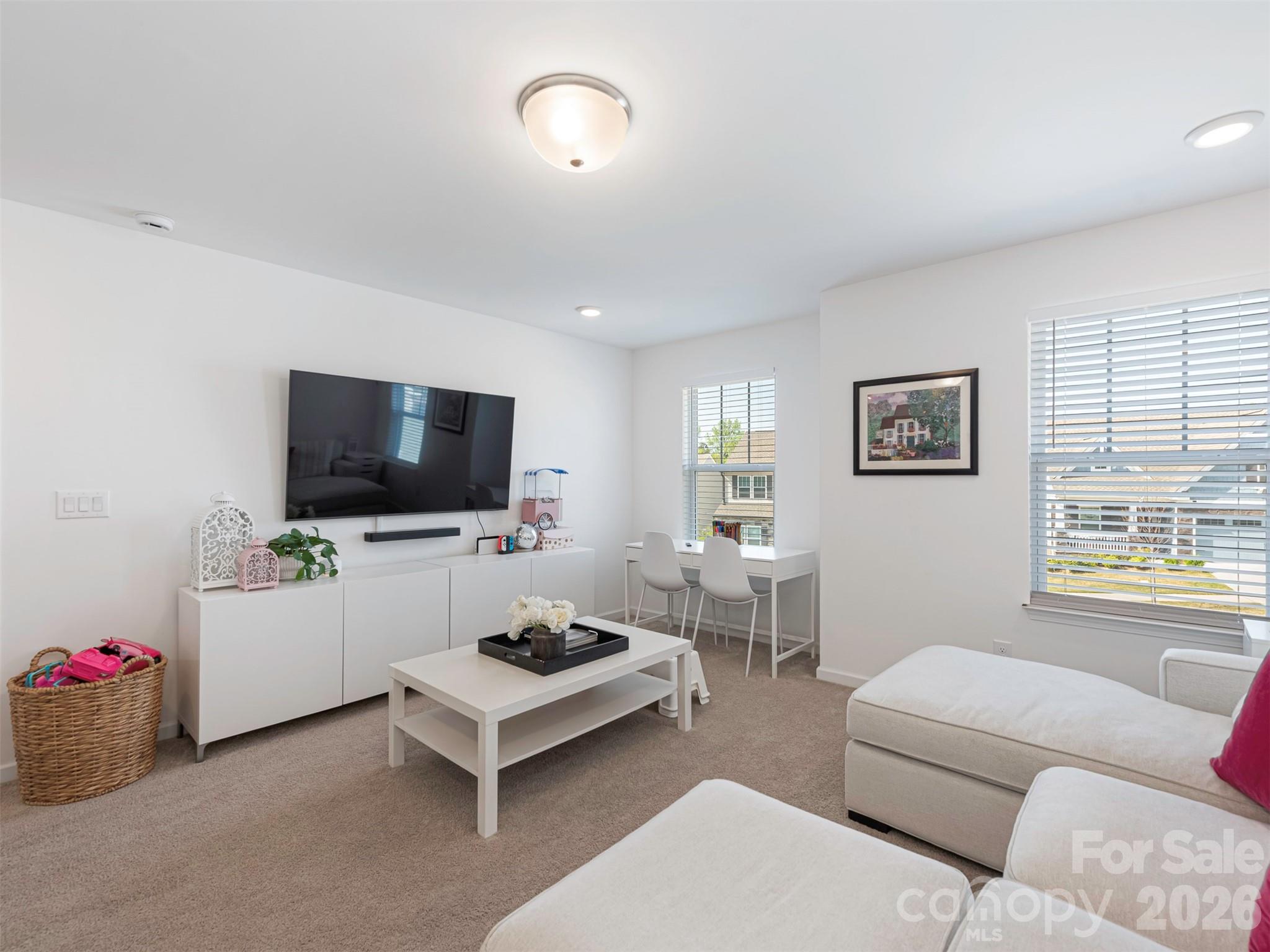 966 Scotch Meadows Loop Monroe, NC 28110 - Photo 34 of 48 a living room with furniture and a flat screen tv