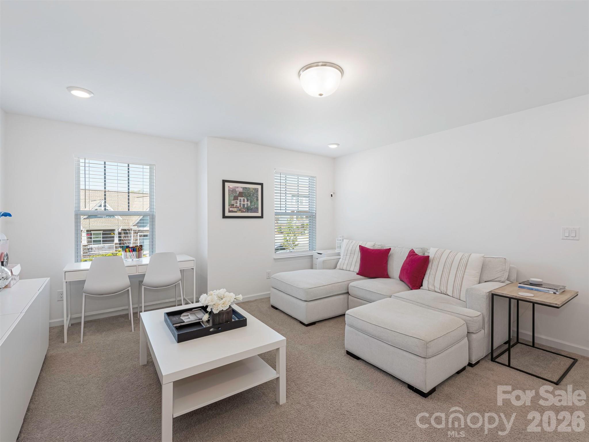 966 Scotch Meadows Loop Monroe, NC 28110 - Photo 35 of 48 a living room with furniture a rug and a window