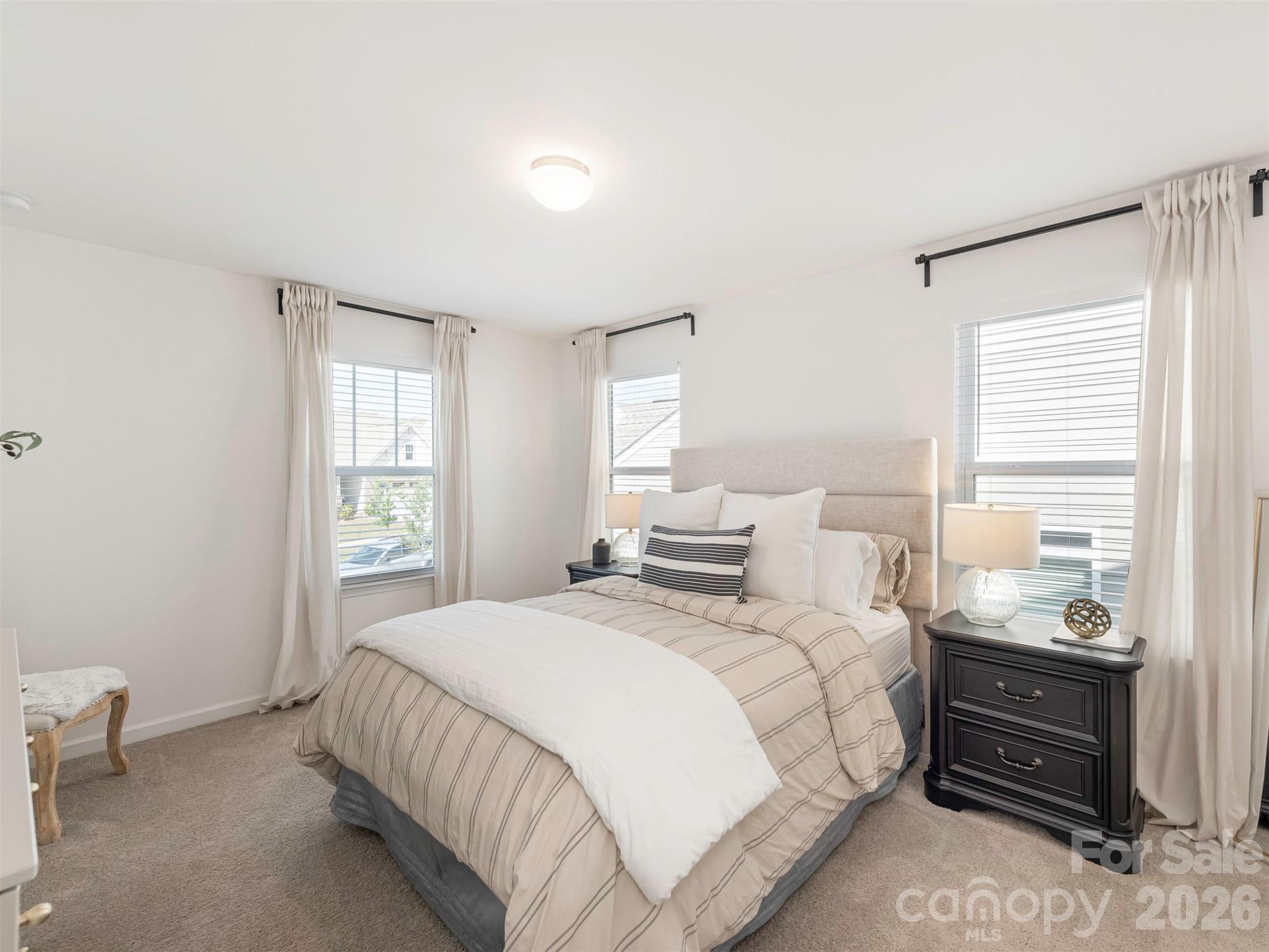 966 Scotch Meadows Loop Monroe, NC 28110 - Photo 37 of 48 a bedroom with a bed and a window