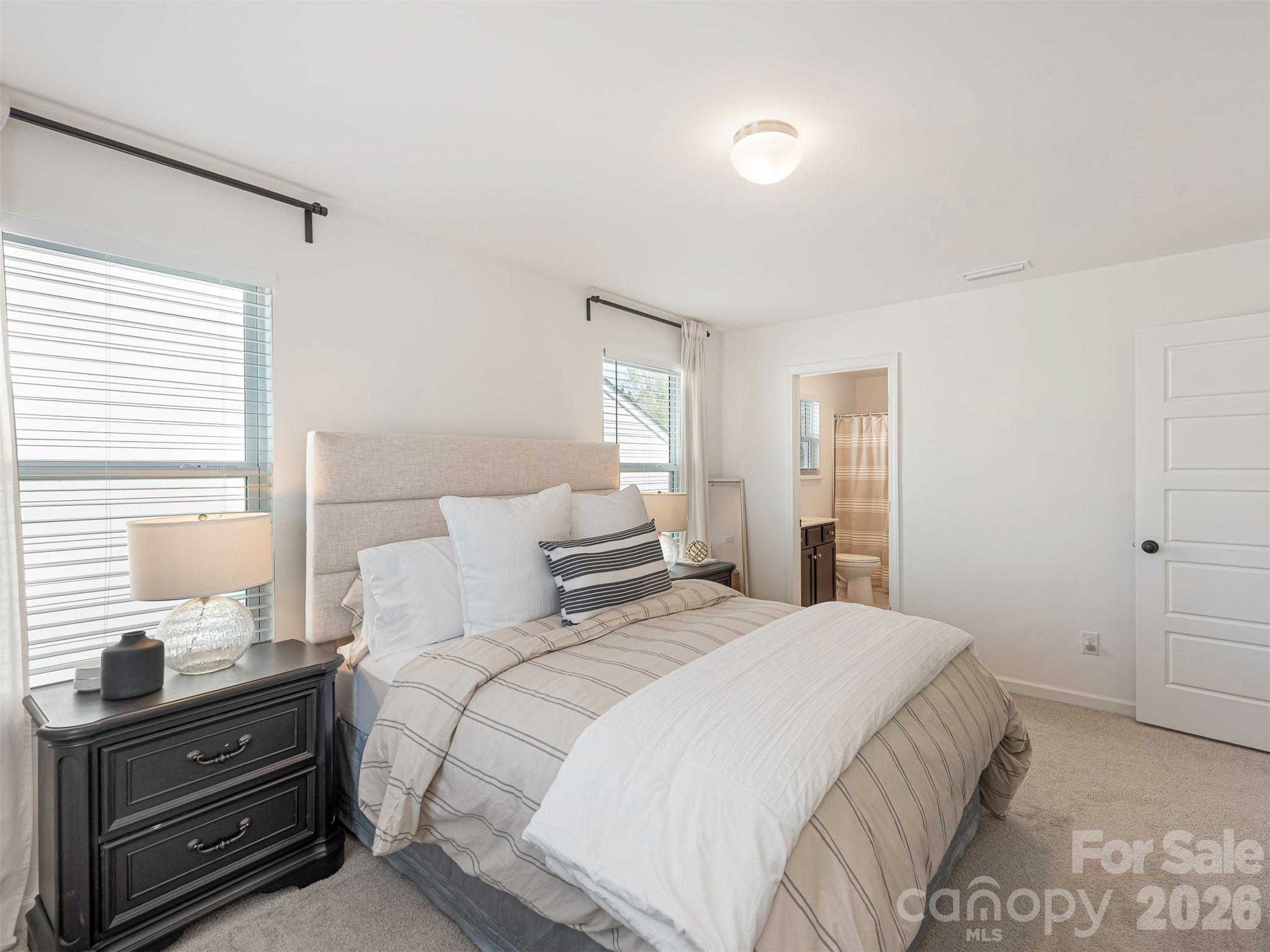 966 Scotch Meadows Loop Monroe, NC 28110 - Photo 38 of 48 a bedroom with a bed and a dresser