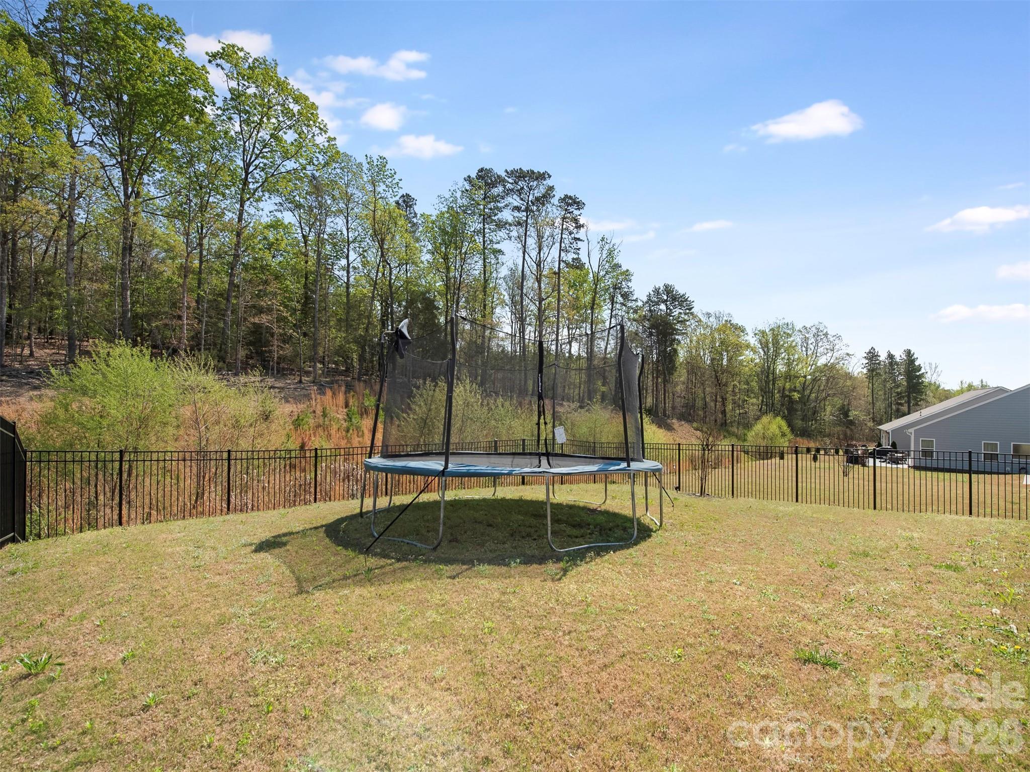 966 Scotch Meadows Loop Monroe, NC 28110 - Photo 47 of 48 a view of a swimming pool with a patio and yard