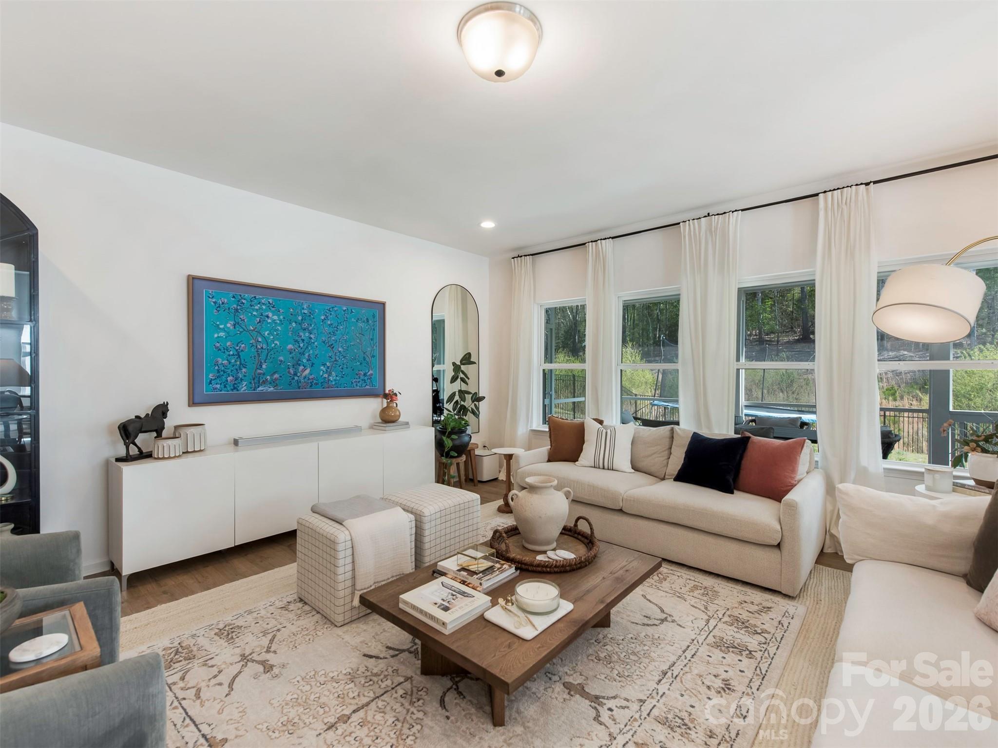 966 Scotch Meadows Loop Monroe, NC 28110 - Photo 6 of 48 a living room with furniture and a large window