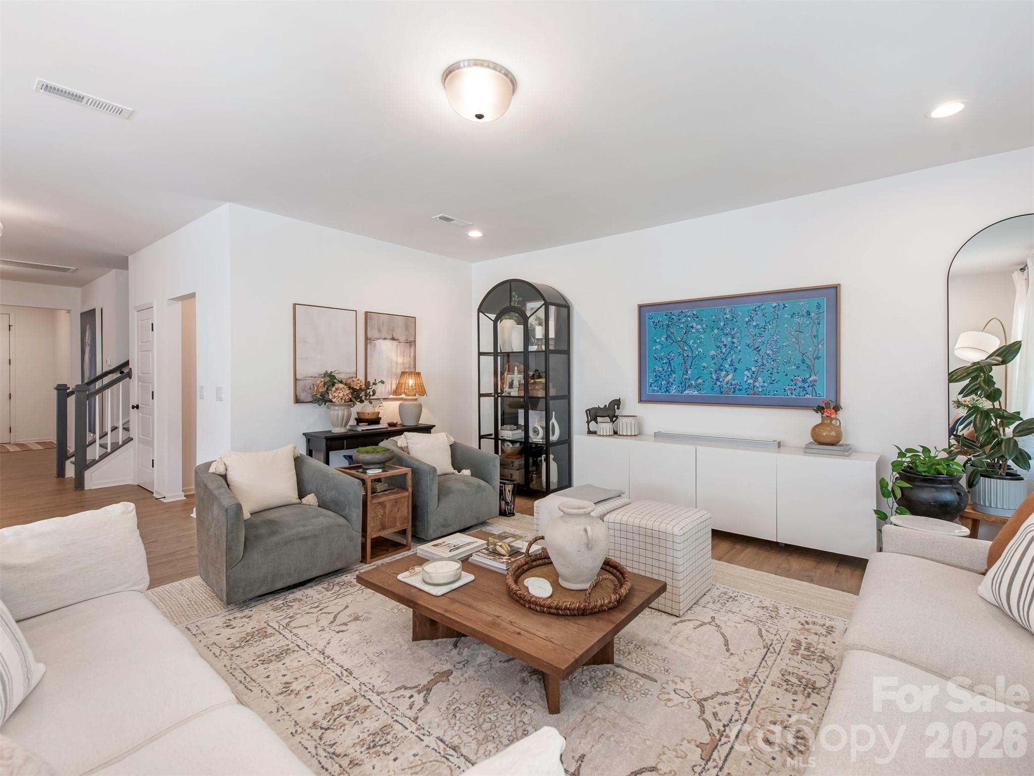 966 Scotch Meadows Loop Monroe, NC 28110 - Photo 8 of 48 a living room with furniture and wooden floor