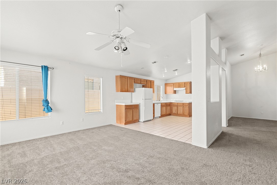 1815 Stablegate Avenue Henderson, NV 89012 - Photo 27 of 28 An open floorplan seamlessly connects the living area and kitchen, perfect for comfortable living.