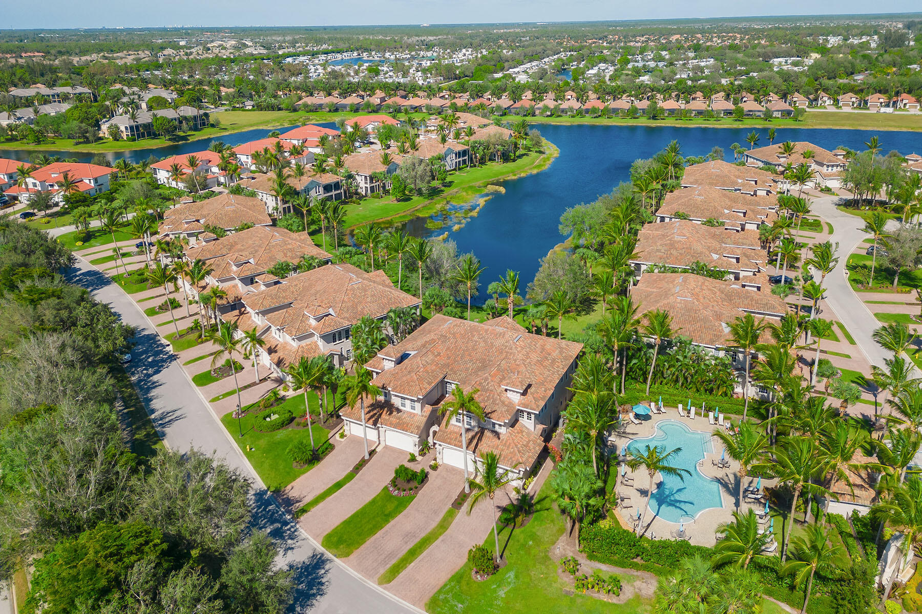 3189 Aviamar Circle, Unit 202 Naples, FL 34114 - Photo 30 of 50 an aerial view of lake residential house with outdoor space