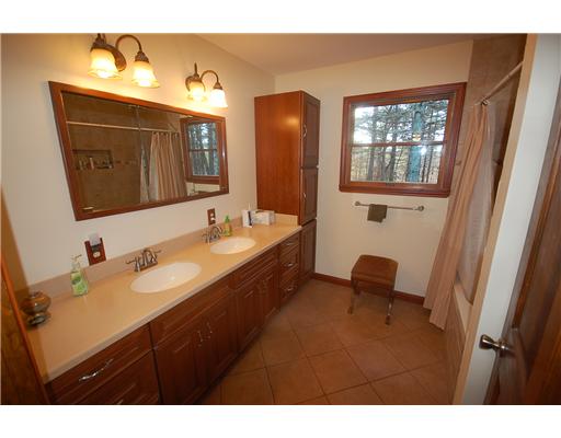 75 Tripps Corner Road Exeter, RI 02822 - Photo 19 of 20 Bathroom. Full bath near bedroom with custom tile around tub/shower