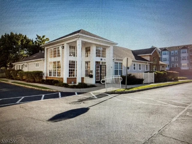 a front view of a building with street view