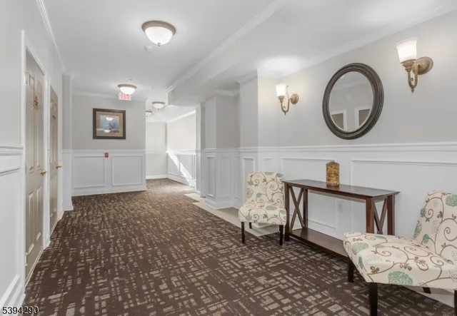 a living room with furniture and a mirror