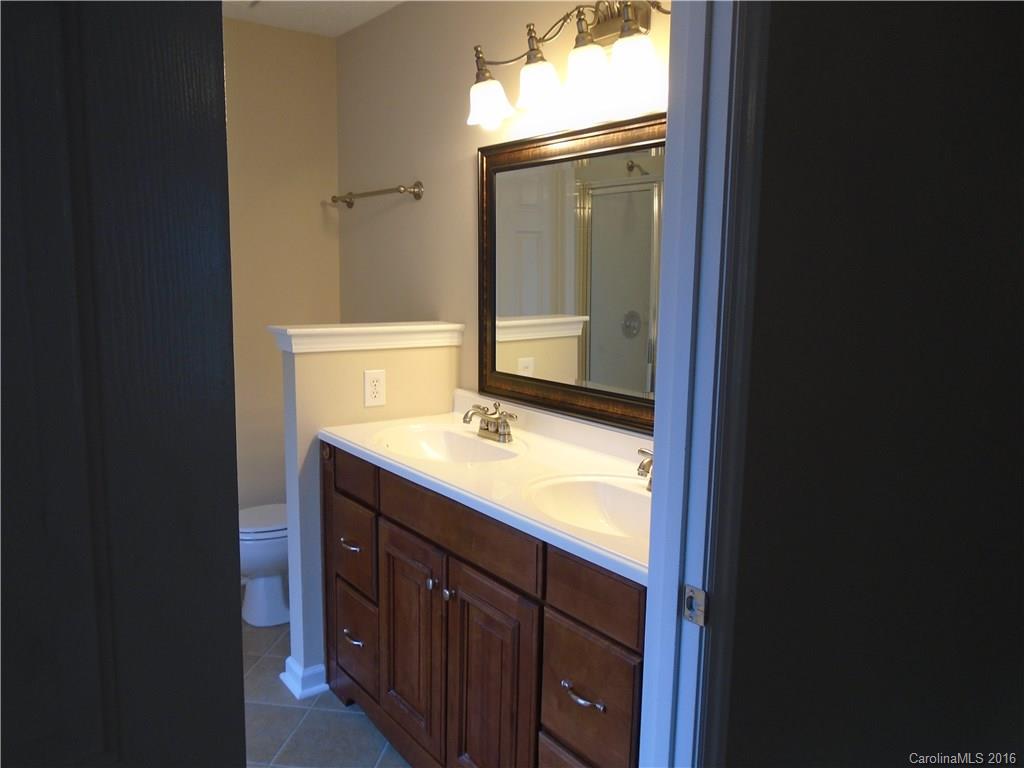 3323 Chistow Road Matthews, NC 28105 - Photo 12 of 12 a bathroom with a sink and a mirror