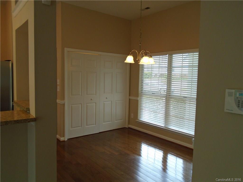 3323 Chistow Road Matthews, NC 28105 - Photo 6 of 12 a view of a livingroom with wooden floor and a window