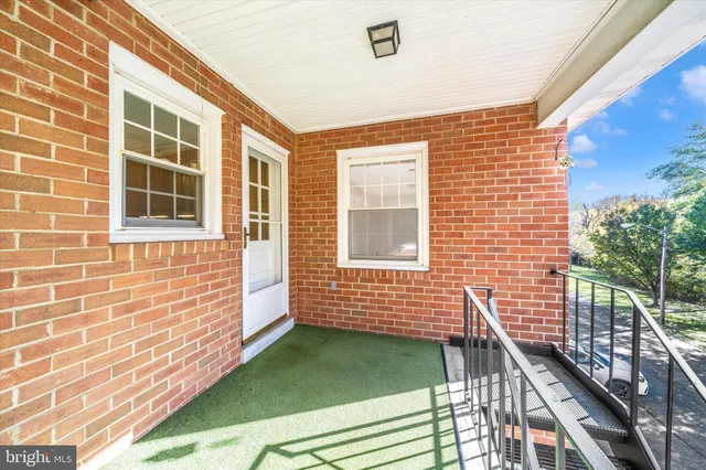 a view of house with backyard