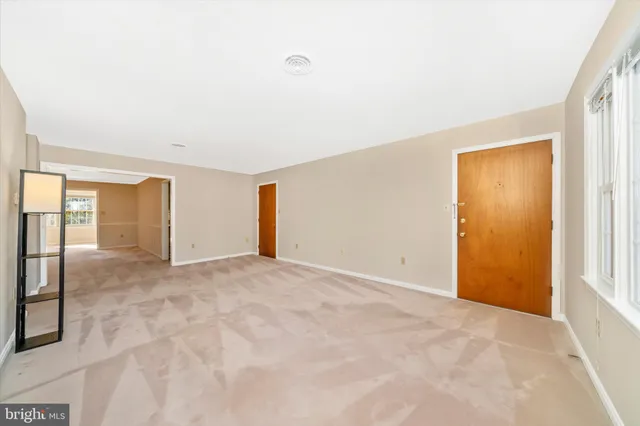 front view of a brick house with a small yard