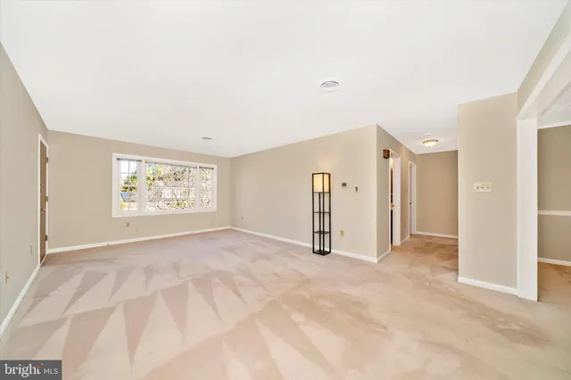 a view of empty room with windows