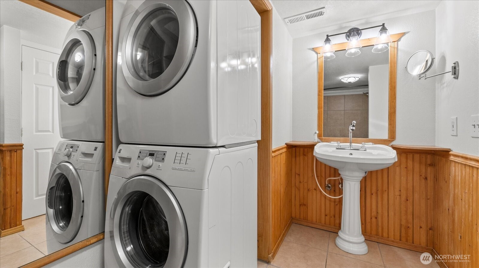 323 75th Street Southeast, Unit B11 Everett, WA 98203 - Photo 12 of 26 a bathroom with a sink mirror and tub