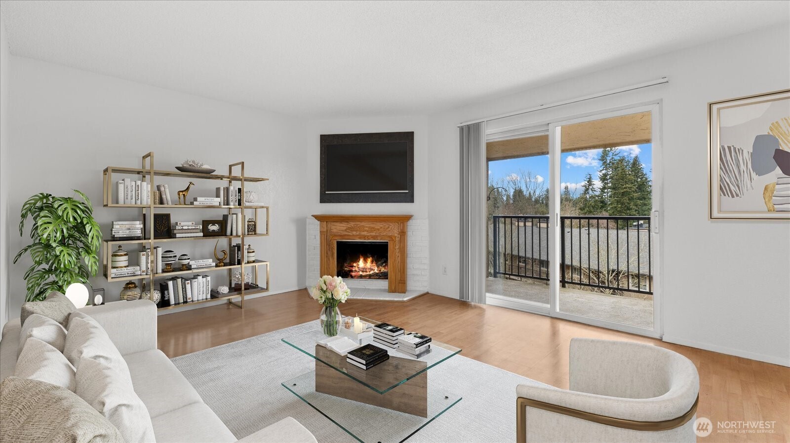 323 75th Street Southeast, Unit B11 Everett, WA 98203 - Photo 3 of 26 a living room with furniture a fireplace and a flat screen tv