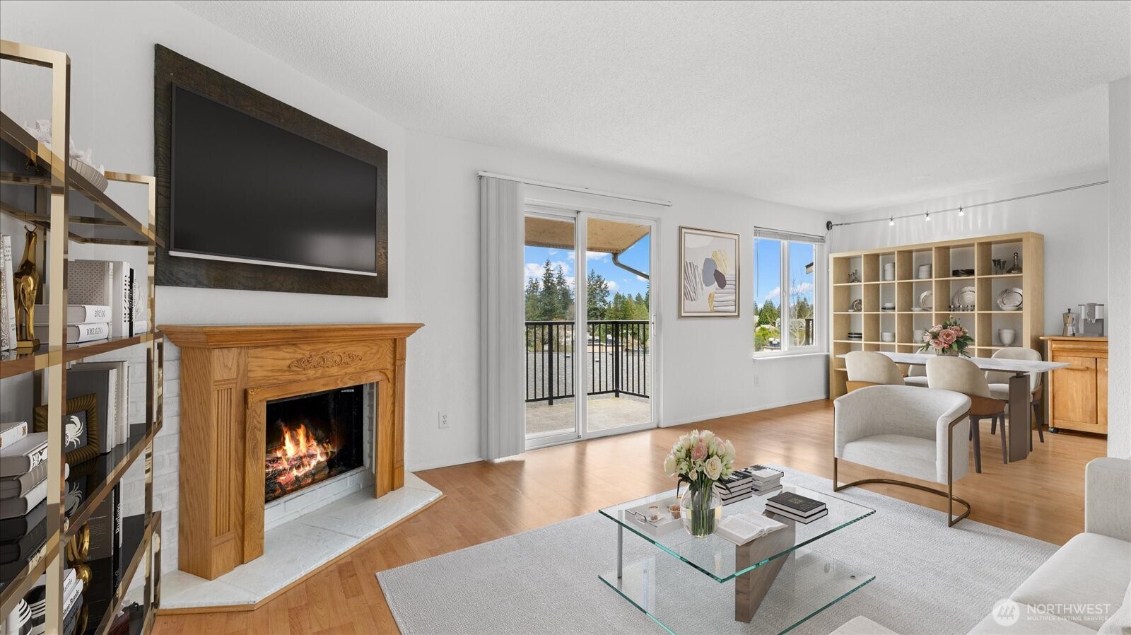 323 75th Street Southeast, Unit B11 Everett, WA 98203 - Photo 4 of 26 a living room with furniture a flat screen tv and a fireplace