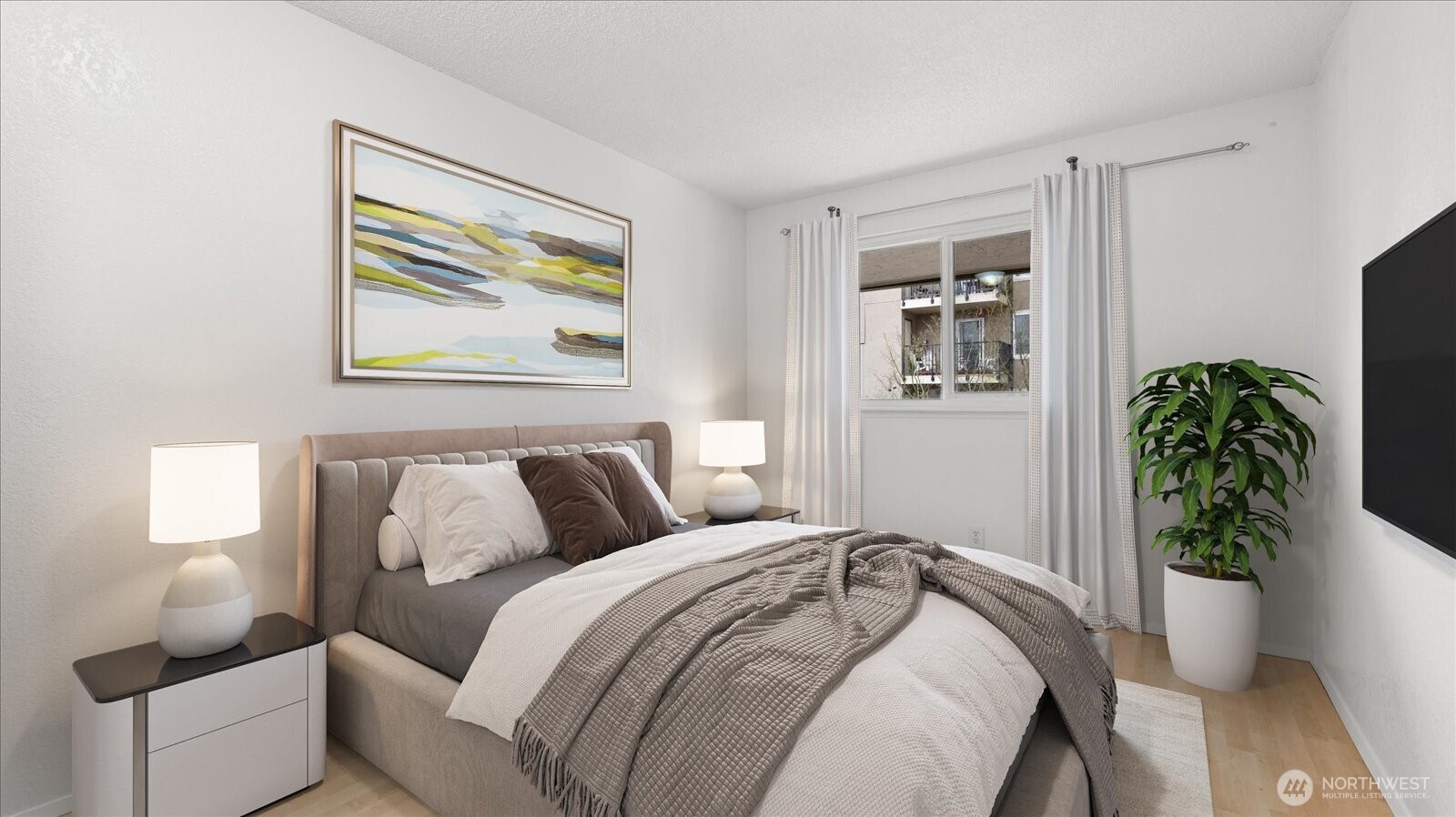 323 75th Street Southeast, Unit B11 Everett, WA 98203 - Photo 5 of 26 a bedroom with a bed and a painting on the wall