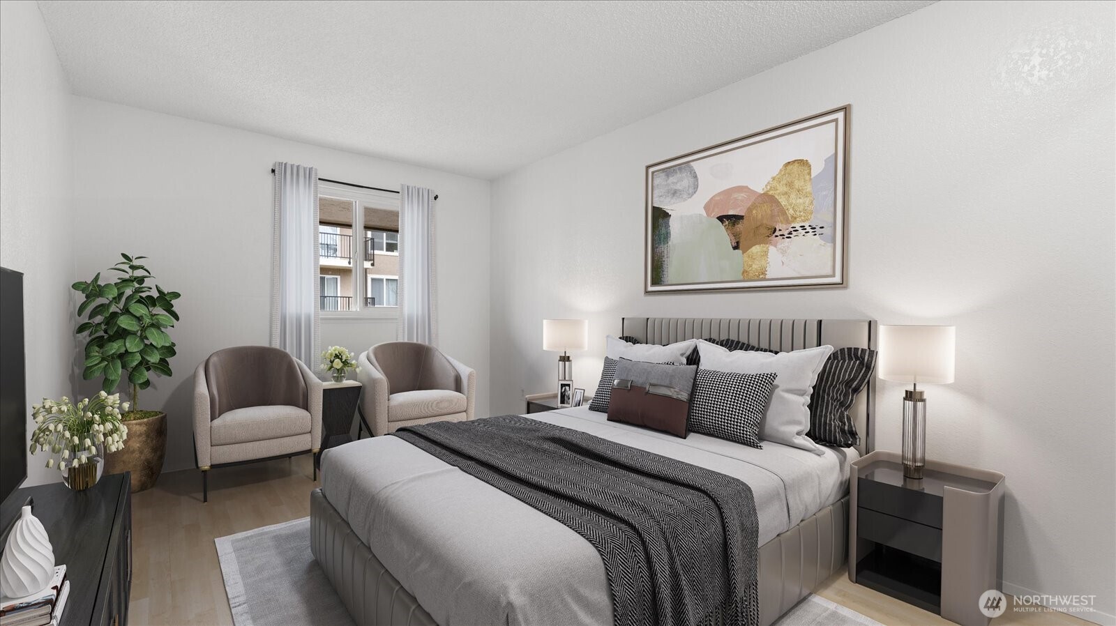 323 75th Street Southeast, Unit B11 Everett, WA 98203 - Photo 6 of 26 a bedroom with a bed and a couch