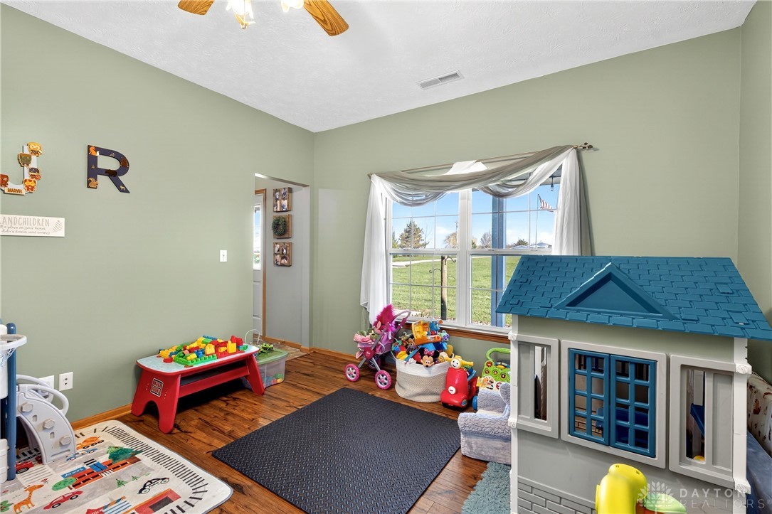 6560 Snyder Road Fletcher, OH 45326 - Photo 12 of 71 This bright playroom features ample natural light and durable wood flooring.