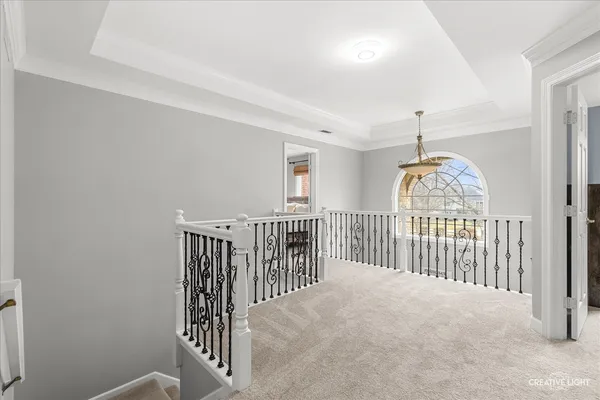 a view of a hallway with windows