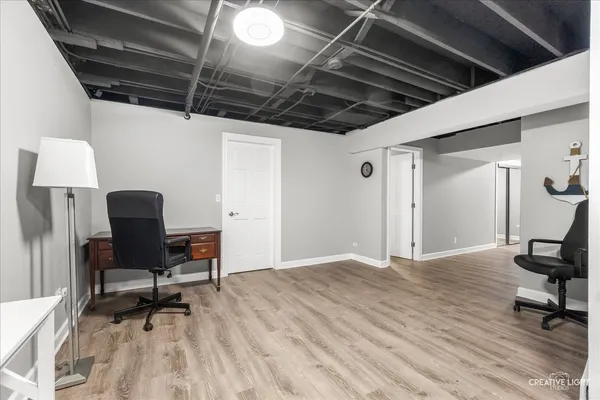 a view of a workspace with furniture and a chair