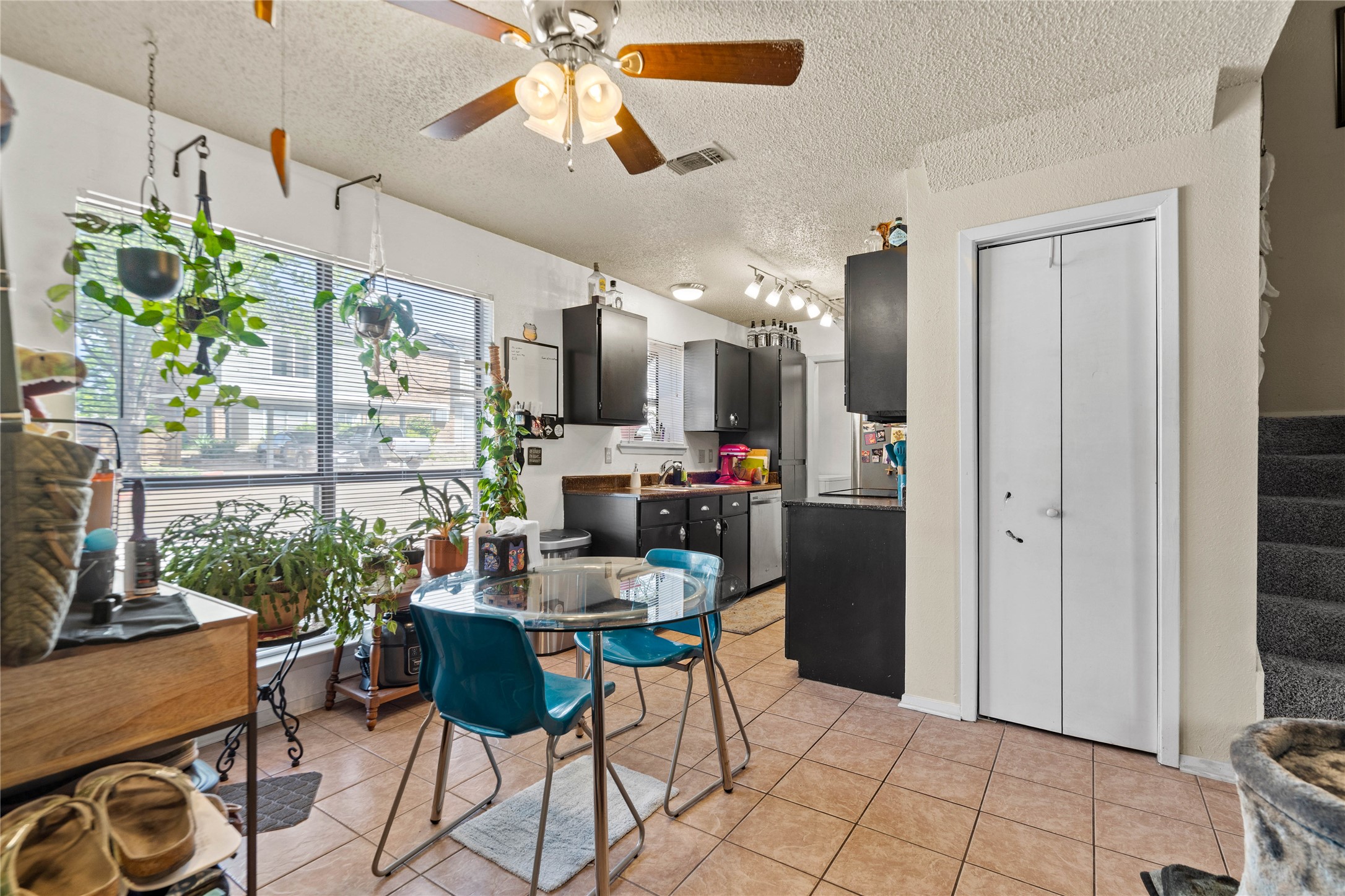 2018 West Rundberg Lane, Unit 4B Austin, TX 78758 - Photo 9 of 28 a dining room filled with furniture and a chandelier fan