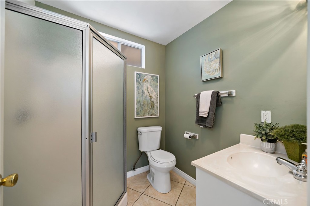 39980 Vía Fernando Temecula, CA 92592 - Photo 30 of 73 a bathroom with a toilet a sink and mirror