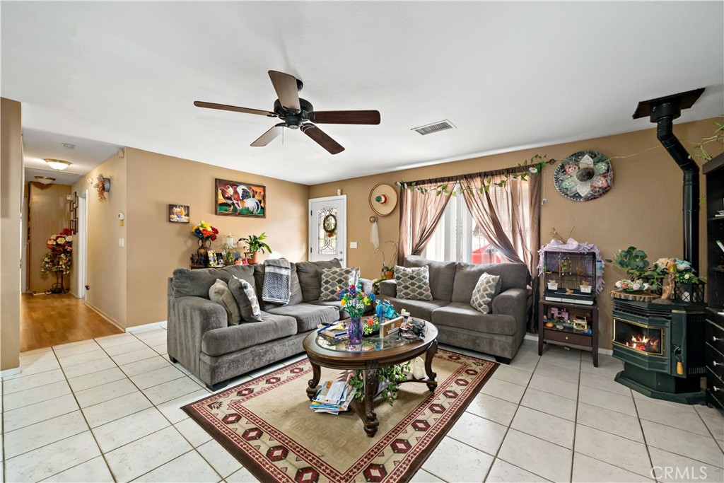 39980 Vía Fernando Temecula, CA 92592 - Photo 48 of 73 a living room with furniture a rug and a large window