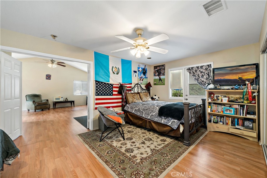 39980 Vía Fernando Temecula, CA 92592 - Photo 55 of 73 a living room with furniture and a book shelf