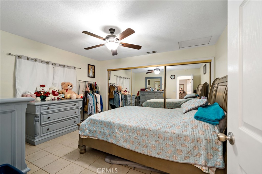 39980 Vía Fernando Temecula, CA 92592 - Photo 62 of 73 a bed room with furniture and a chandelier