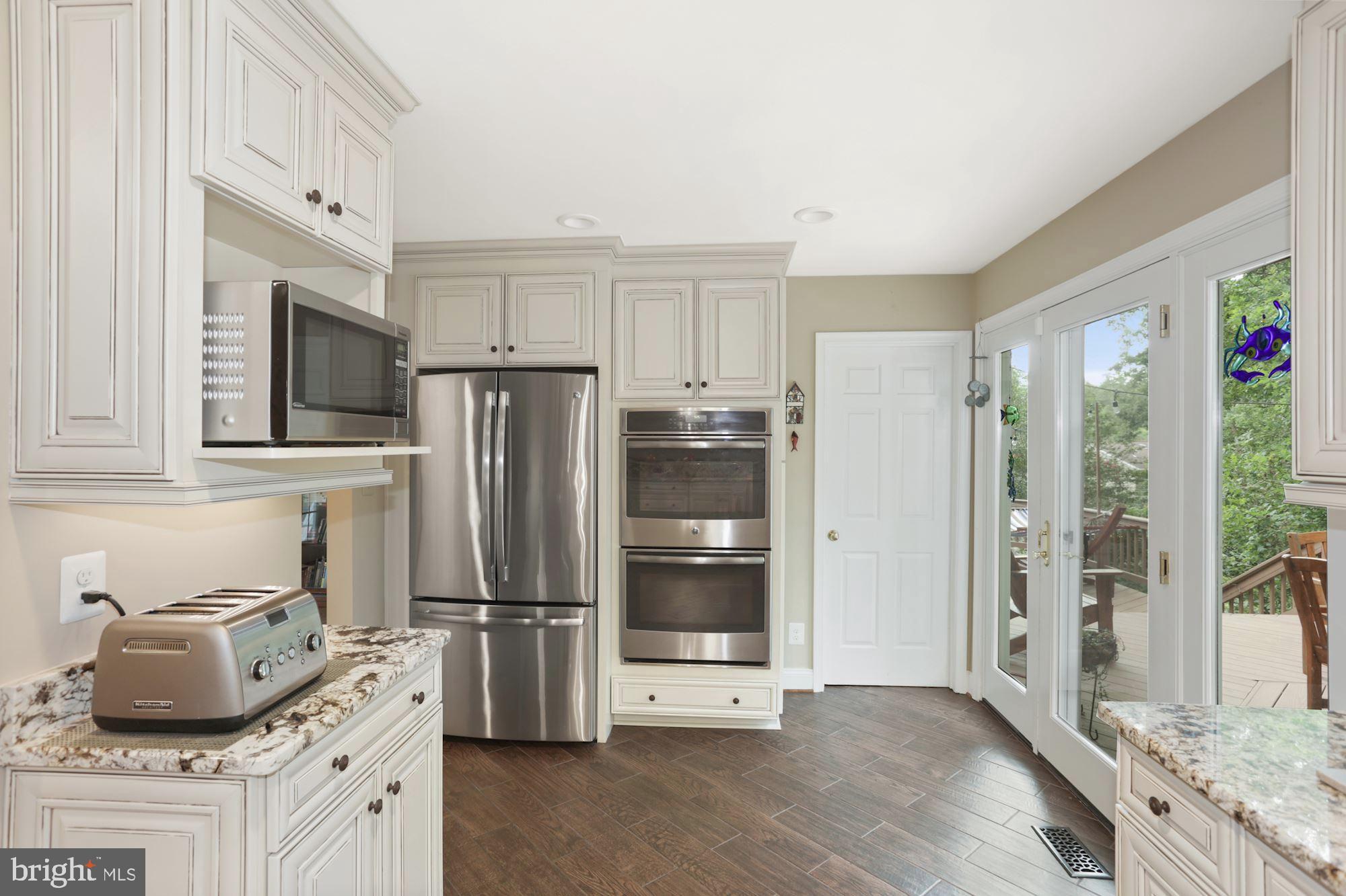 1958 Barton Hill Road Reston, VA 20191 - Photo 7 of 32 Stainless Appliances and entry to tiered deck