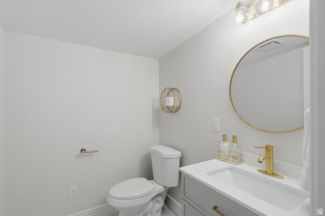 10676 Urban Rdg Cove South Jordan, UT 84095 - Photo 36 of 48 Contemporary bathroom vanity with integrated sink and gold-finish faucet