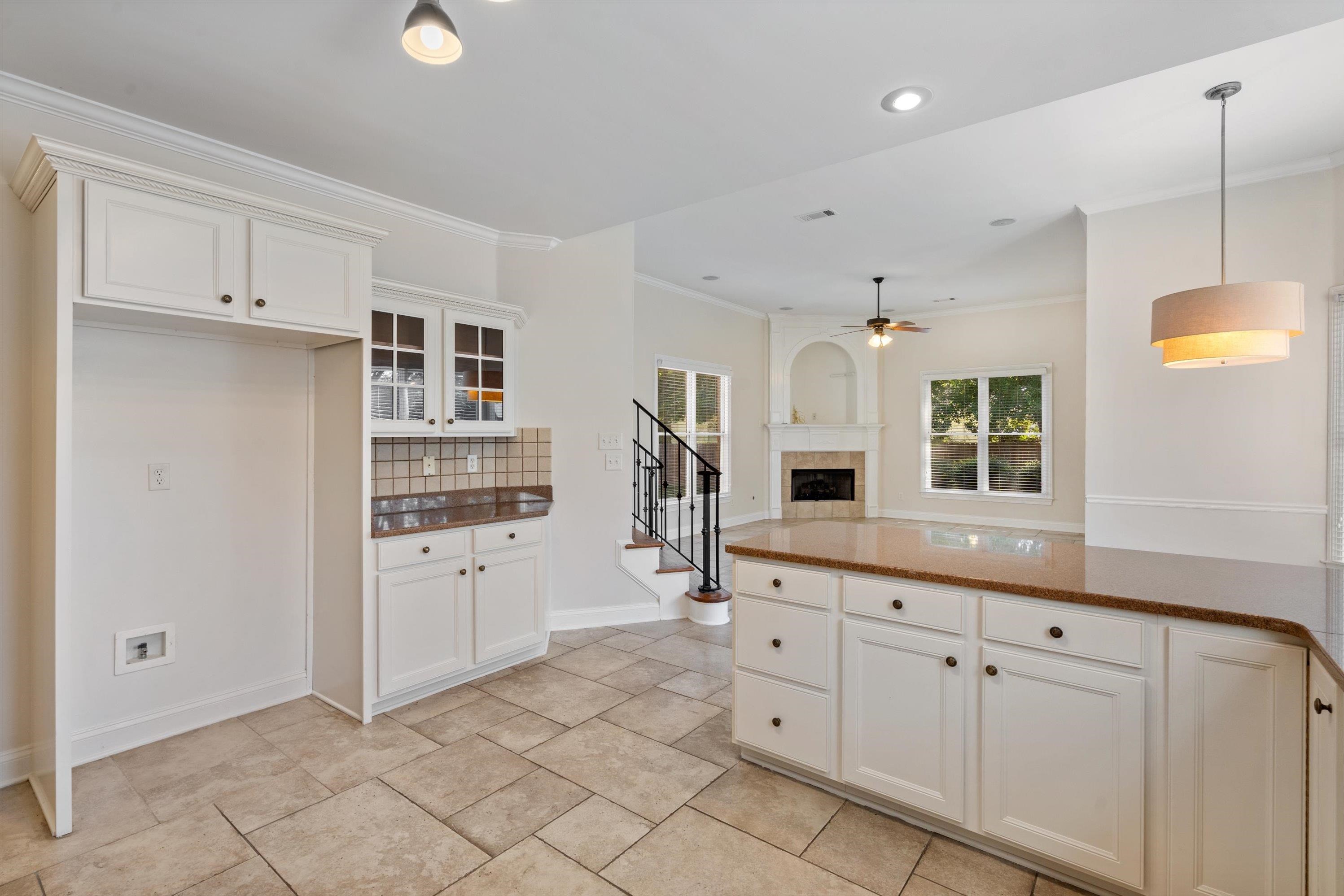 1710 Stillwind Lane Collierville, TN 38017 - Photo 12 of 40 Kitchen opens to eat-in area and cozy hearth room