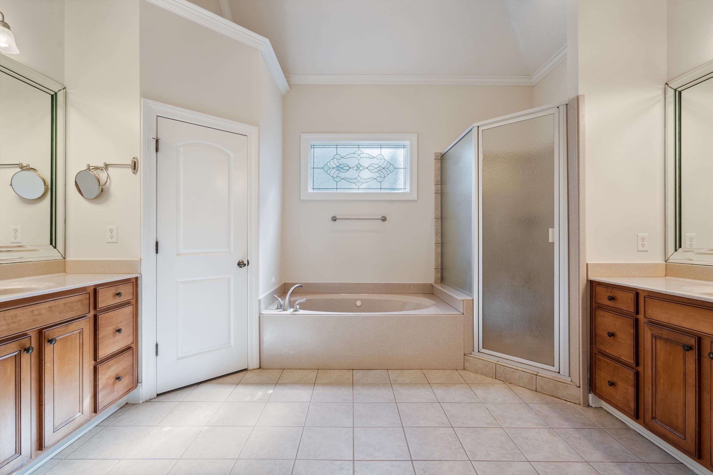 1710 Stillwind Lane Collierville, TN 38017 - Photo 16 of 40 Primary bathroom with separate tub and shower, and double vanities