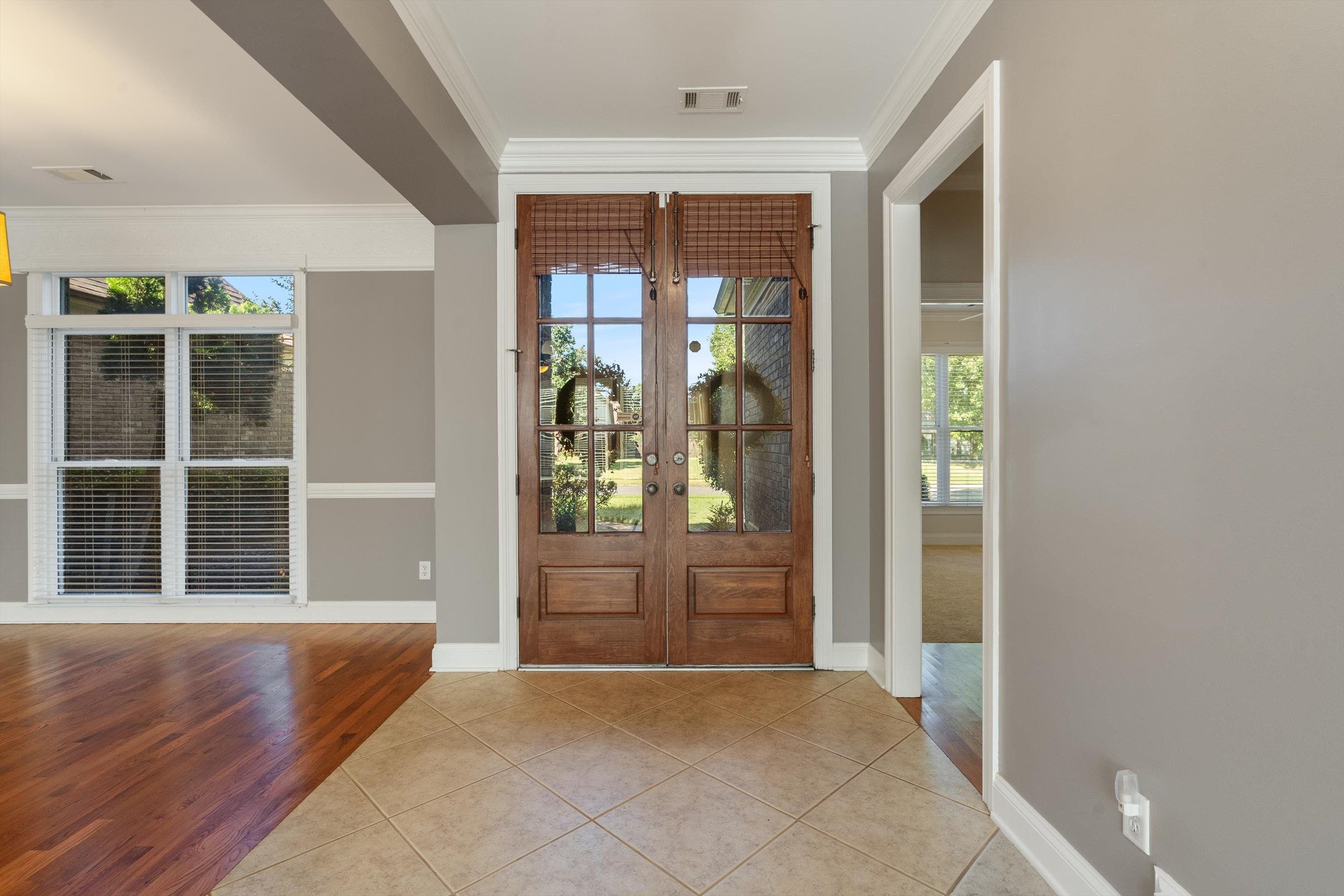 1710 Stillwind Lane Collierville, TN 38017 - Photo 3 of 40 Entrance foyer with tile & gleaming hardwood floors