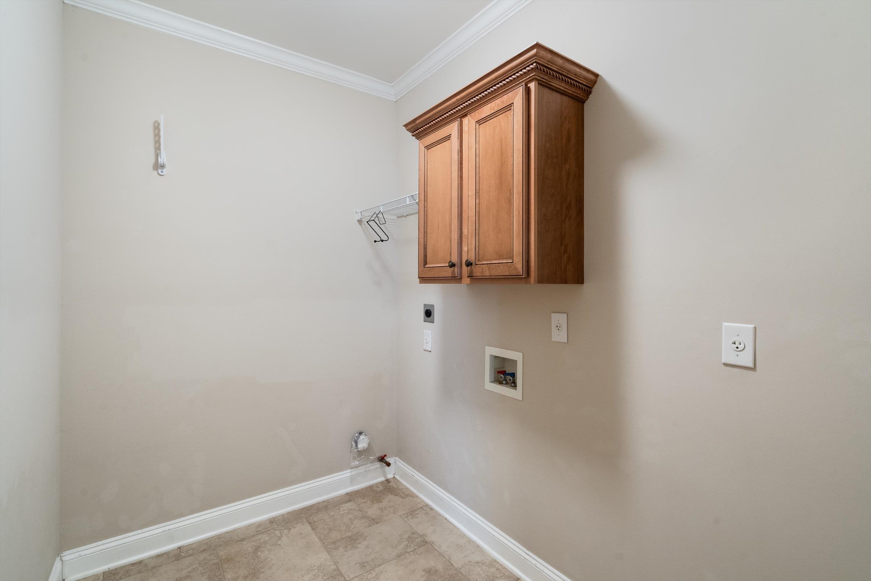 1710 Stillwind Lane Collierville, TN 38017 - Photo 31 of 40 The large laundry is conveniently located off the garage