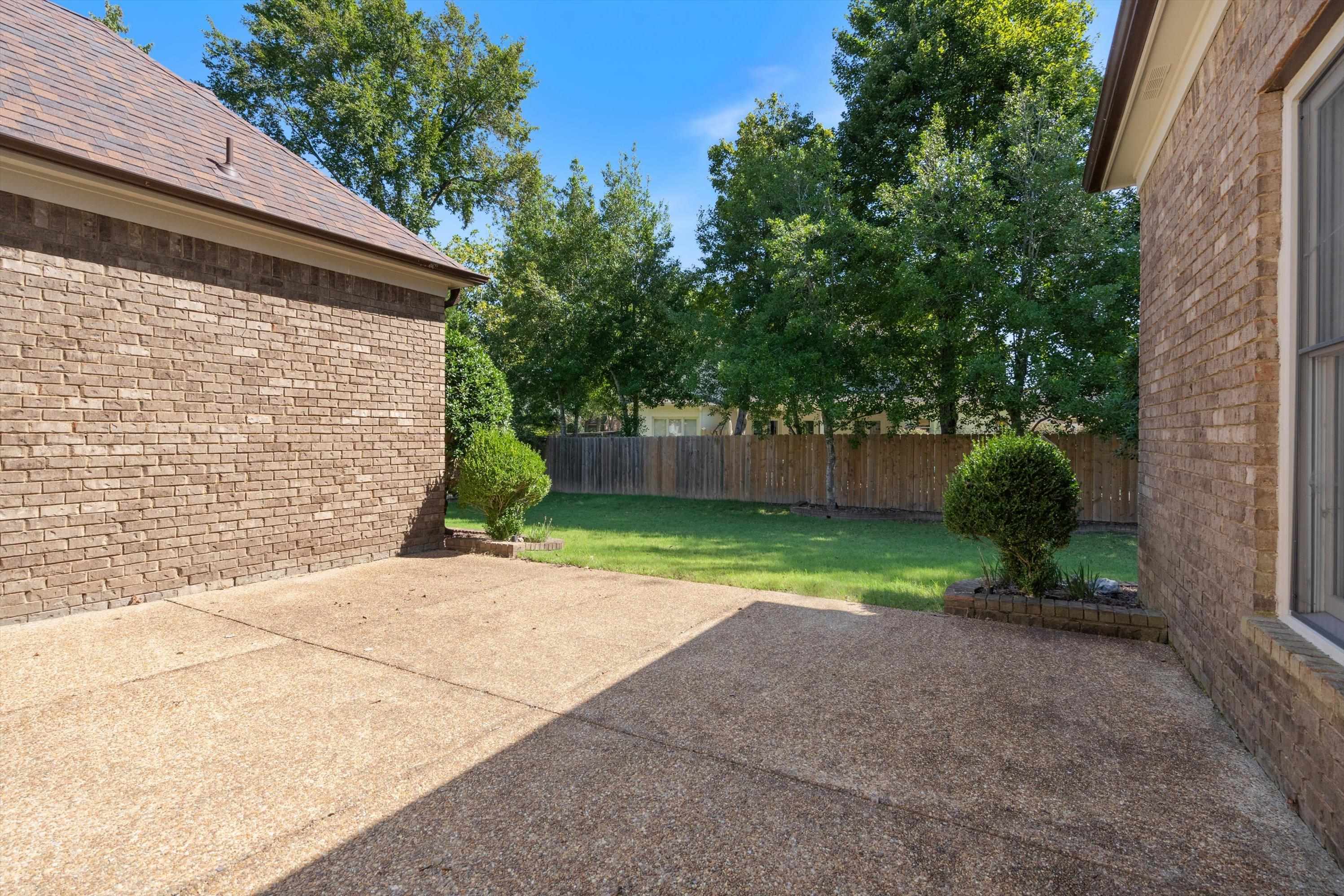 1710 Stillwind Lane Collierville, TN 38017 - Photo 34 of 40 Spacious patio overlooking grassy backyard